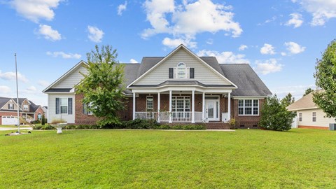 a large house with a lawn in front of it