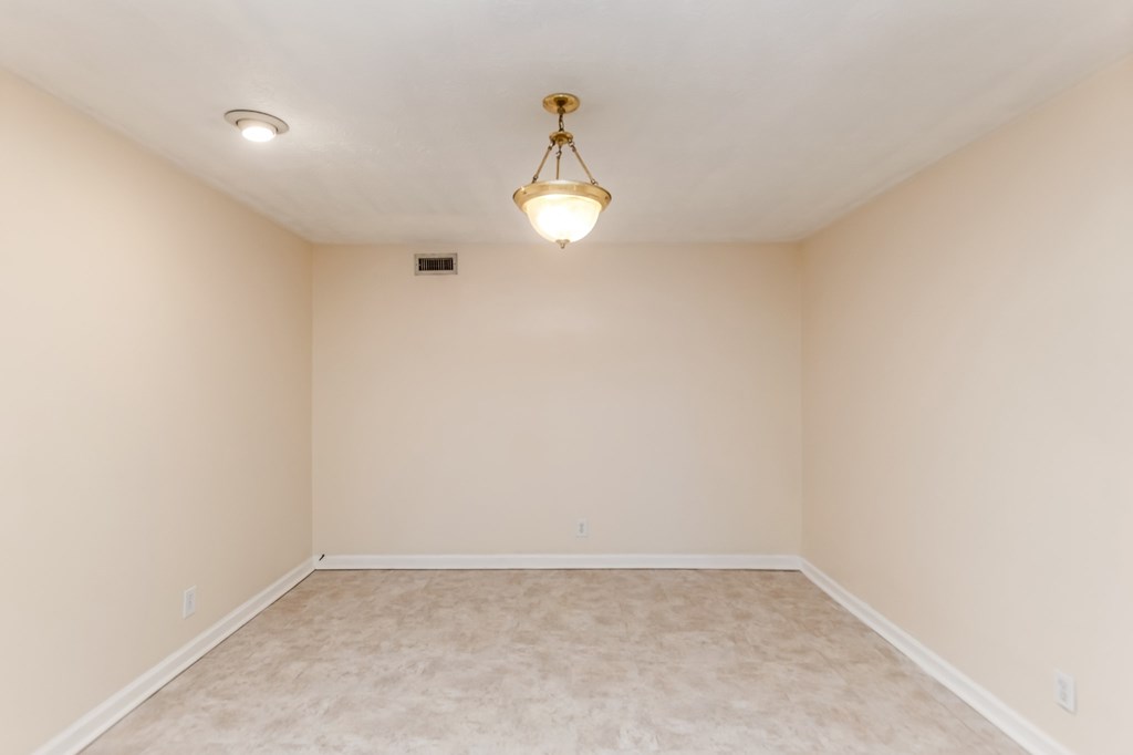 A room with a light fixture on the ceiling.