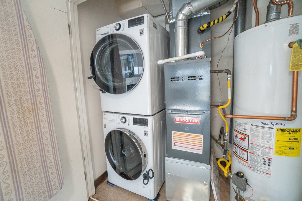 the washer and dryer in the laundry room are next to each other