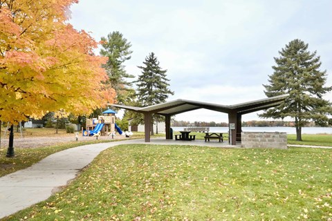 a park with a playground and a picnic table