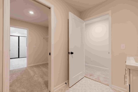 a bedroom with a closet and an open door