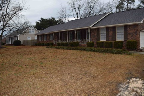 a house with a yard in front of it