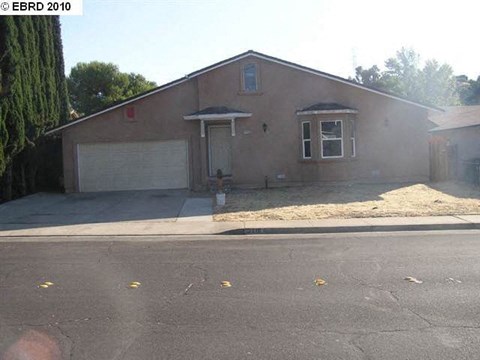 a house with a driveway and a garage door