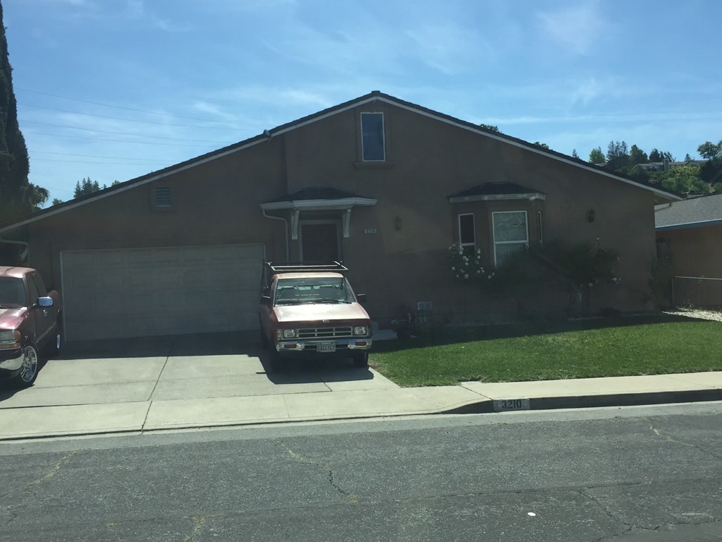 a house with a car parked in front of it