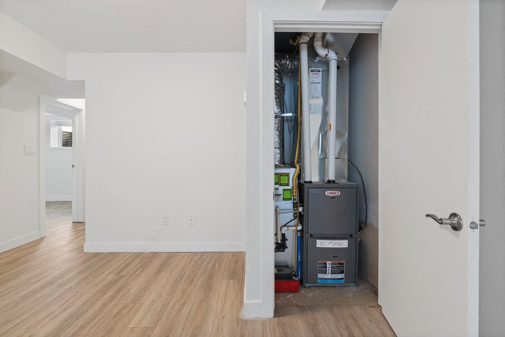 a room with a vacuum cleaner in a closet