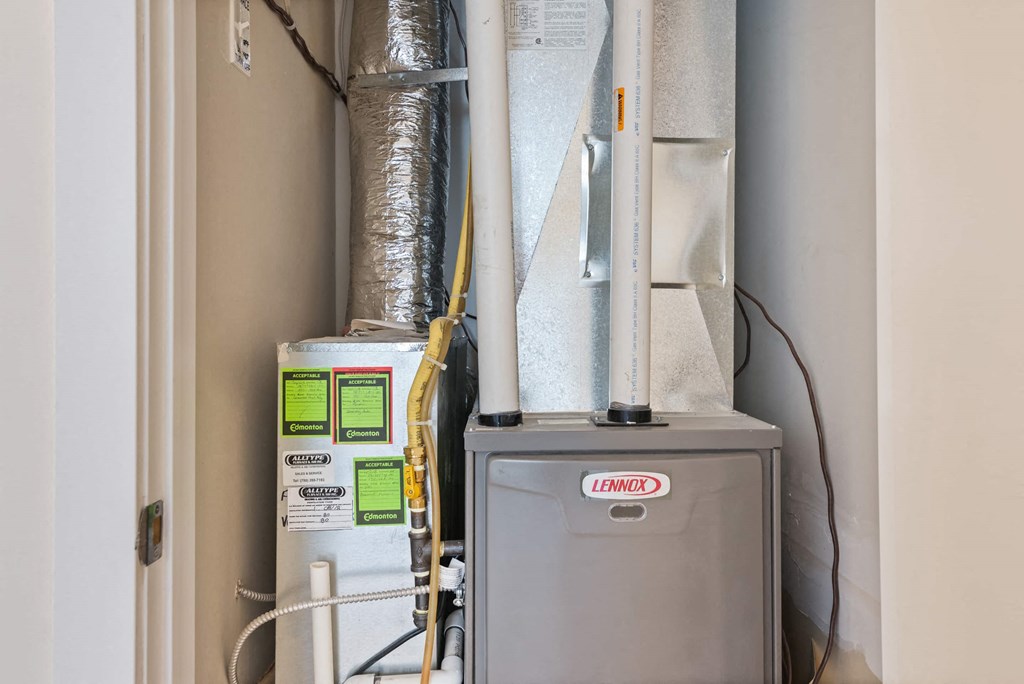 a heating unit in a room next to a door