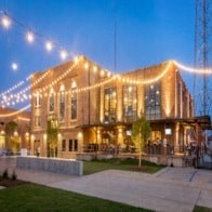 the building where the hotel is located is lit up with lights