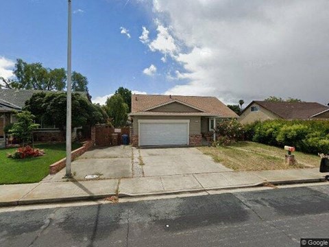 a house with a driveway and a garage door