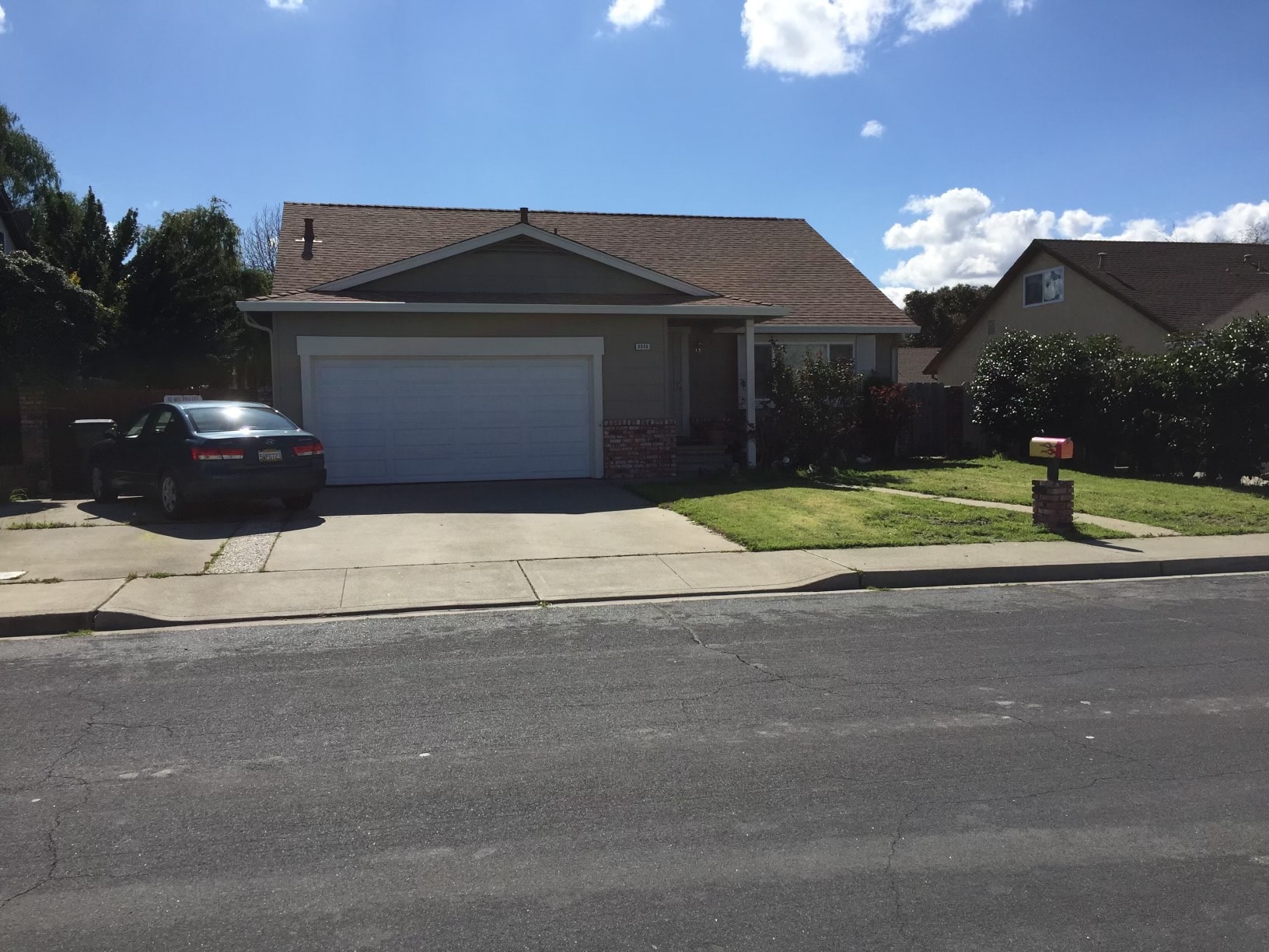 a house with a car parked in front of it