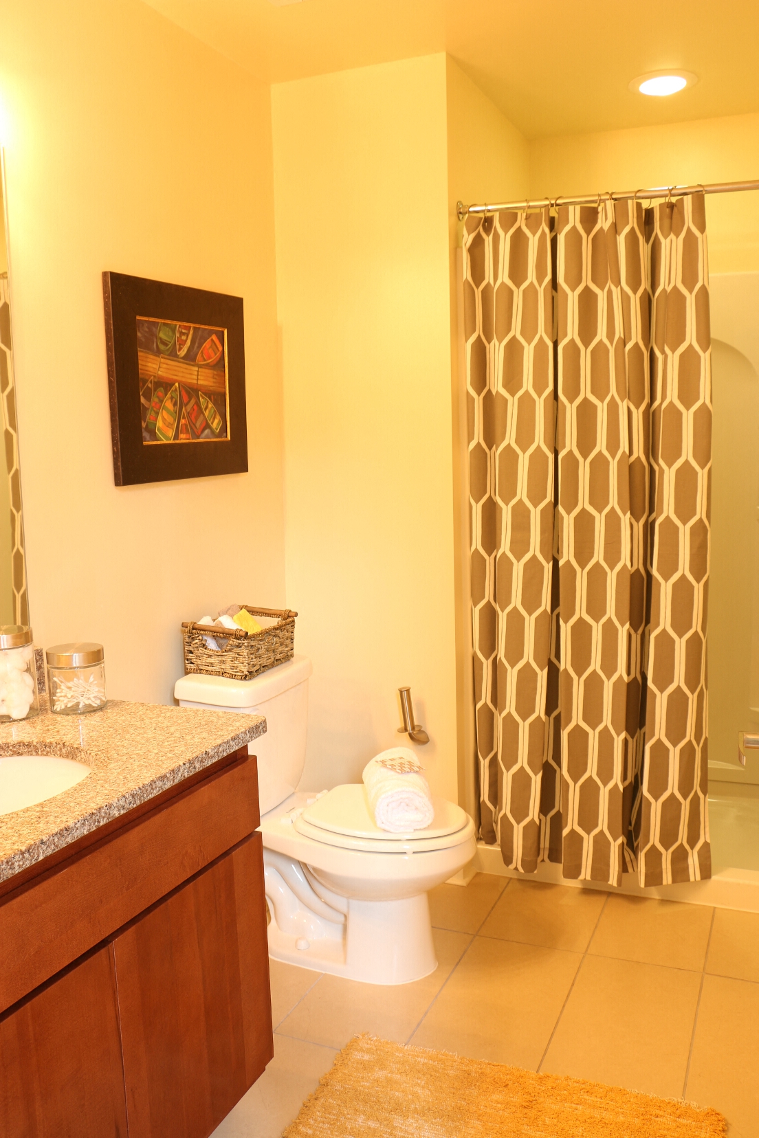 a bathroom with a toilet and a shower with a shower curtain