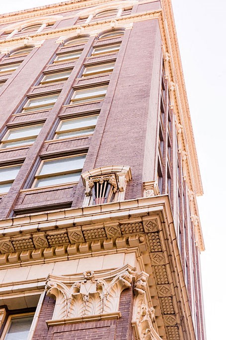 a tall building with a window on the side of it