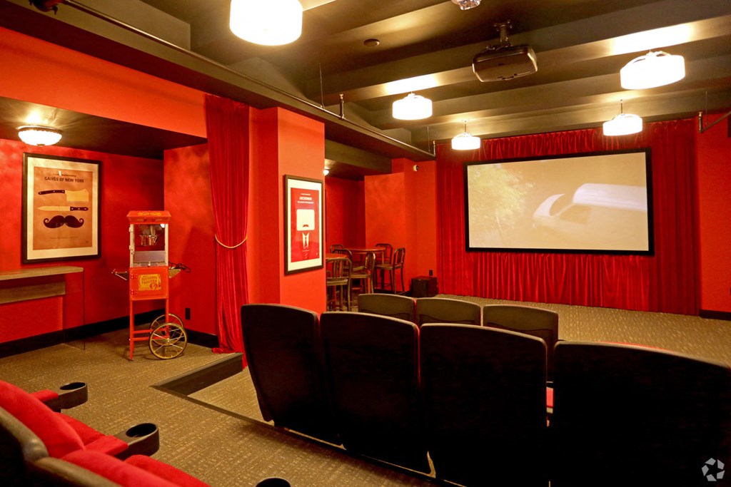 a screening room with chairs and a projector