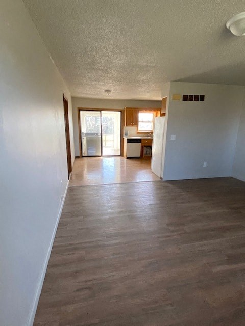 A room with wooden floors and white walls.