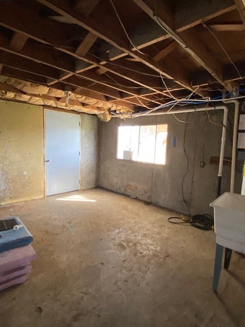 A room with a window and a door is under construction.