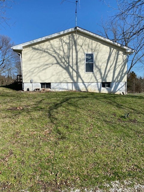A white building with a black antenna on the roof.