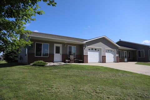 a house with a lawn in front of it