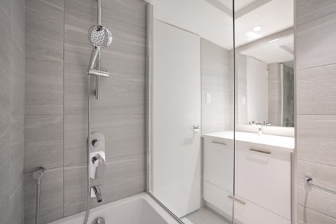 a bathroom with a shower and a sink