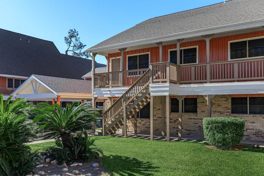 a view of a house with a porch and a staircase