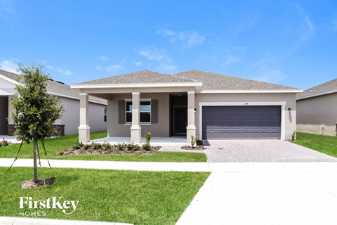 a house with a driveway and a garage door