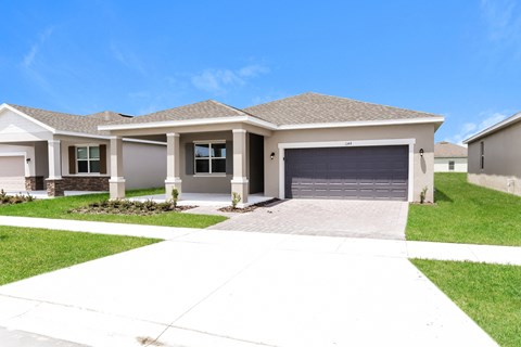 a house with a driveway and a garage door