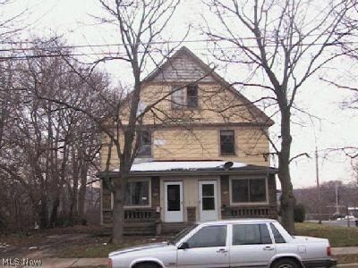 a house with a white car parked in front of it