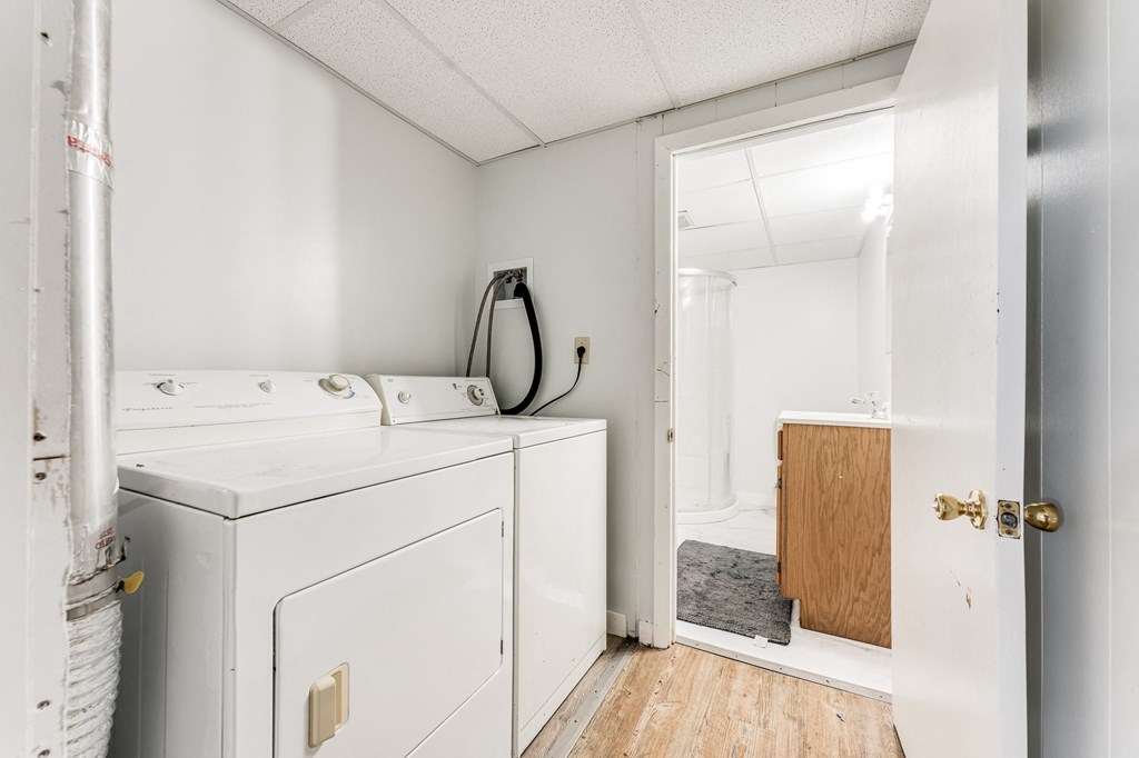 A white washer and dryer in a small laundry room.