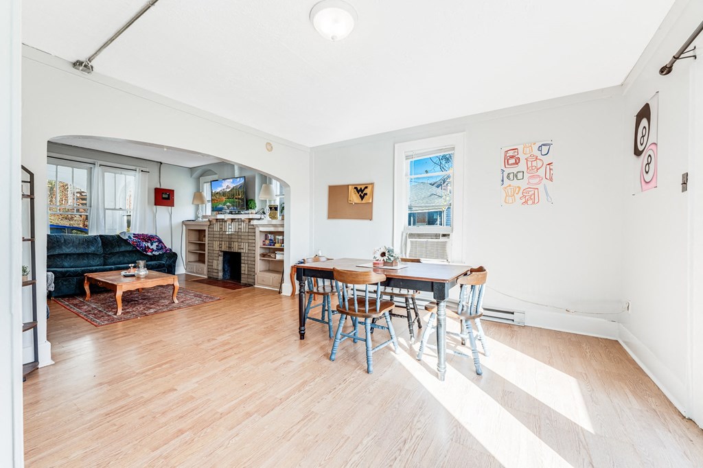 A room with a table and chairs in it.