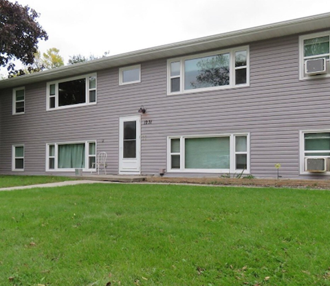 a house with a lawn in front of it