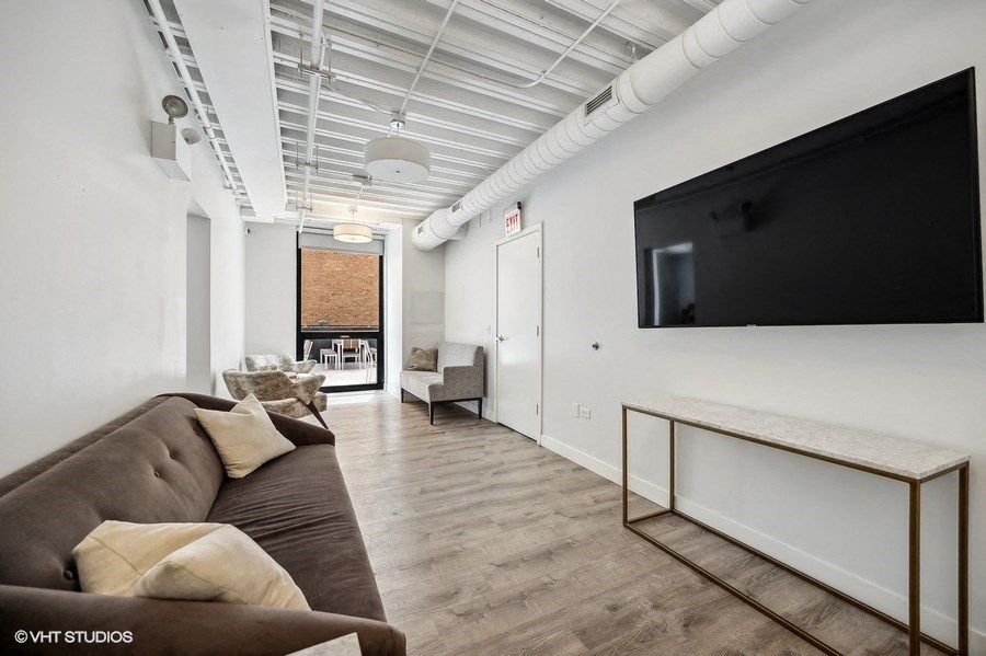a living room with a couch and a tv