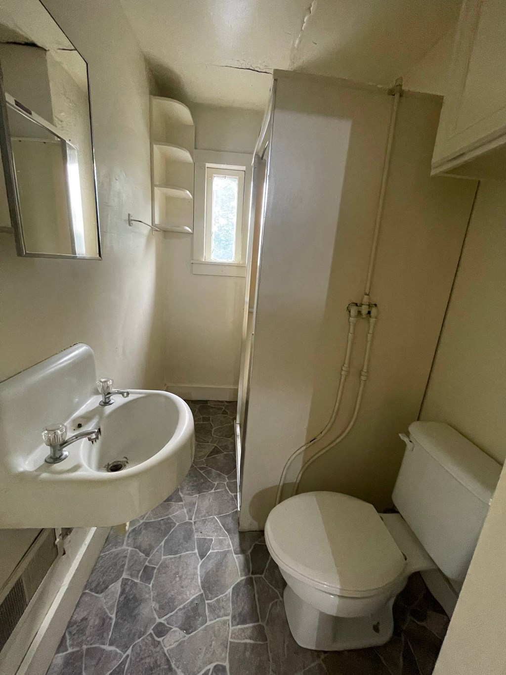 a small bathroom with a toilet and a sink