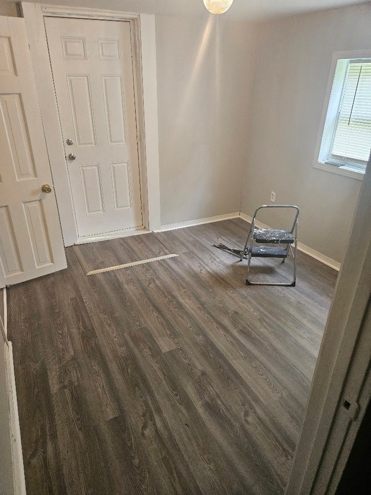 a empty room with a chair in the middle of it