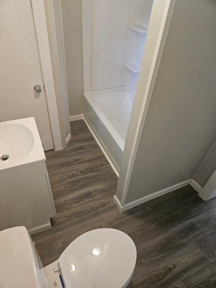 a small bathroom with a toilet and a shower