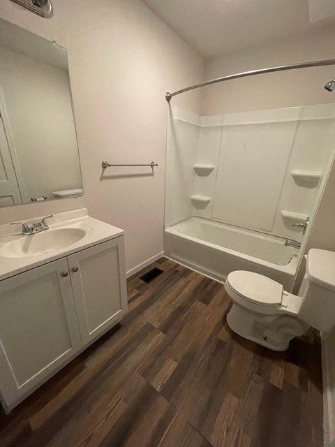a bathroom with a sink toilet and a shower