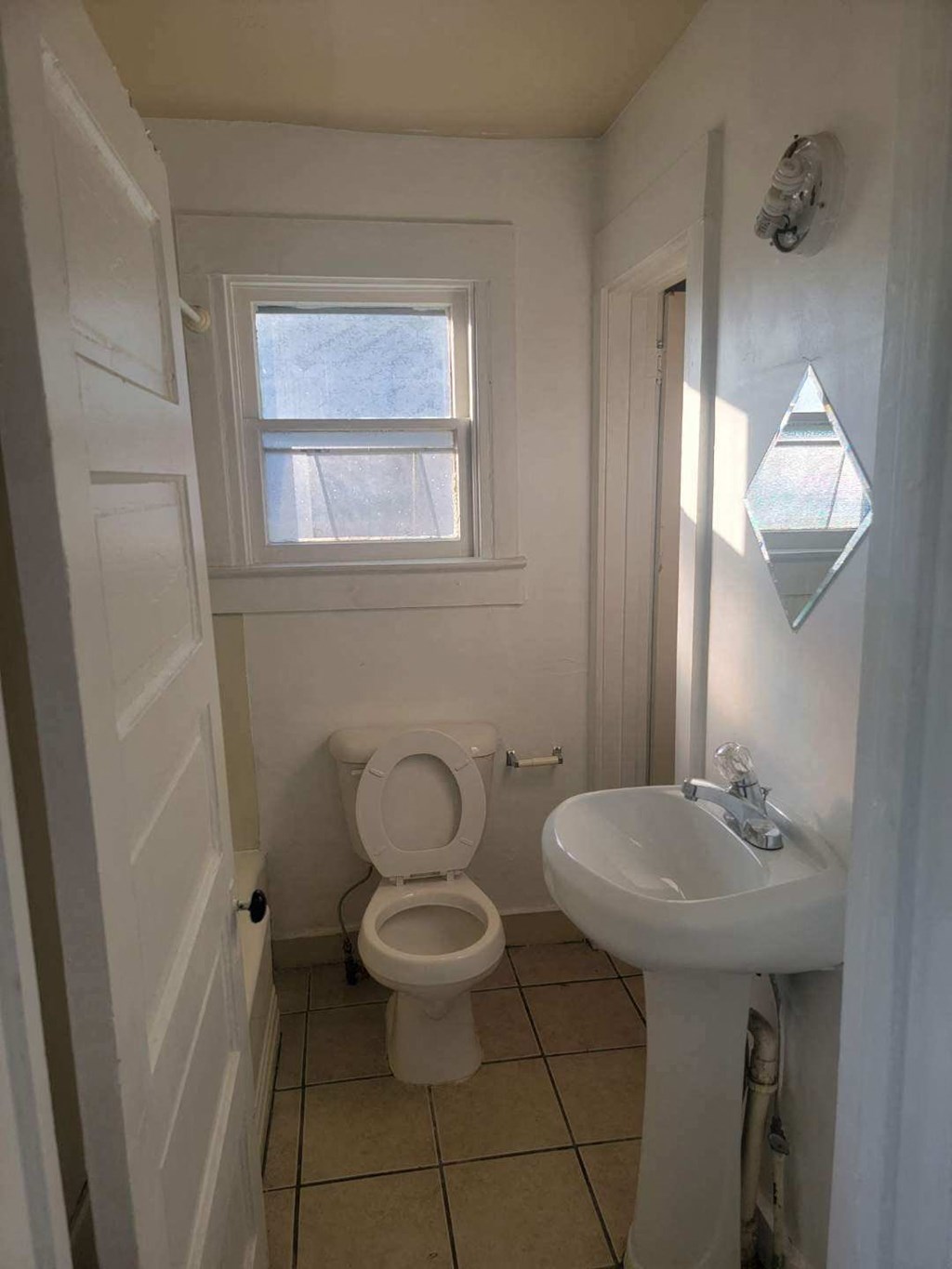 a small bathroom with a toilet and a sink