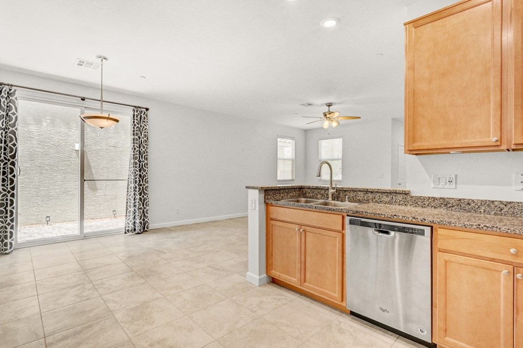 a kitchen with wooden cabinets and a counter top