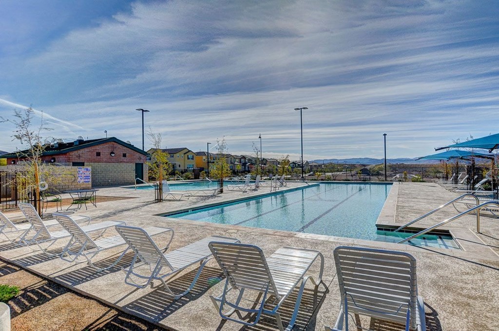our apartments have a resort style pool and lounge chairs
