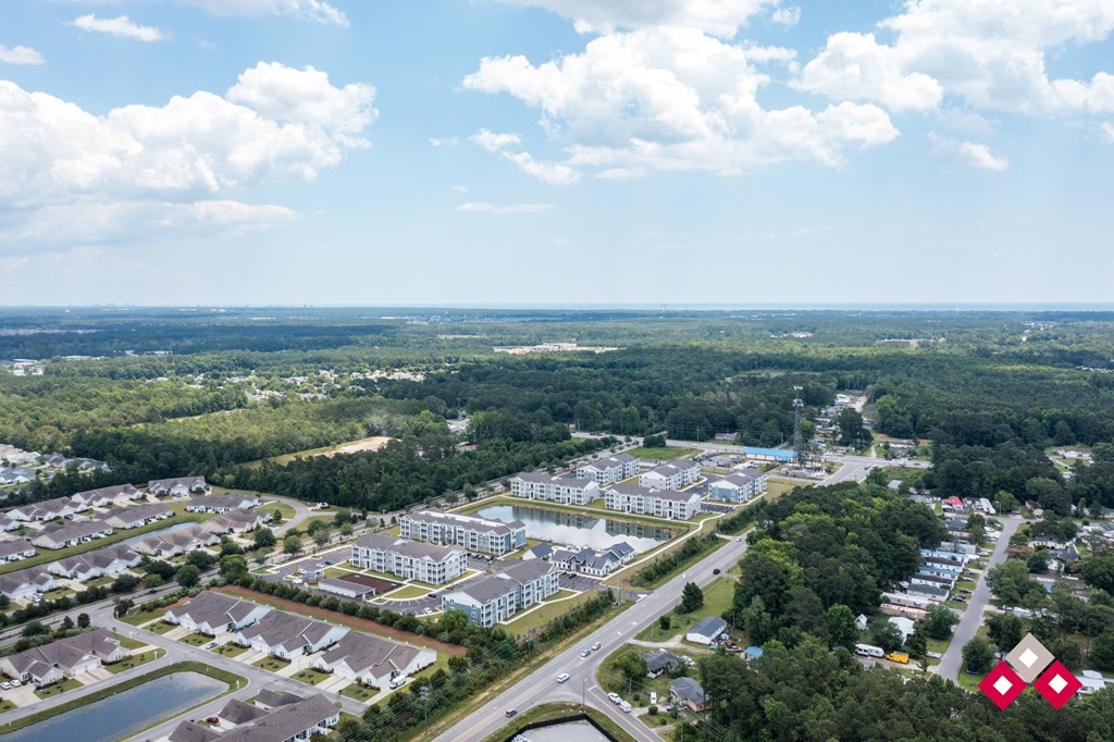 an aerial view of a city with buildings and trees