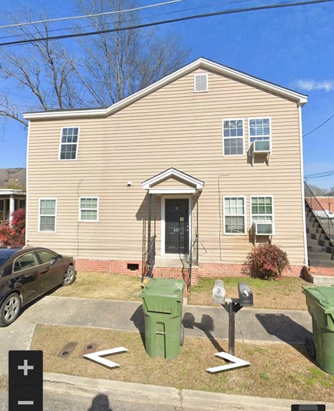 a house with a parking meter in front of it