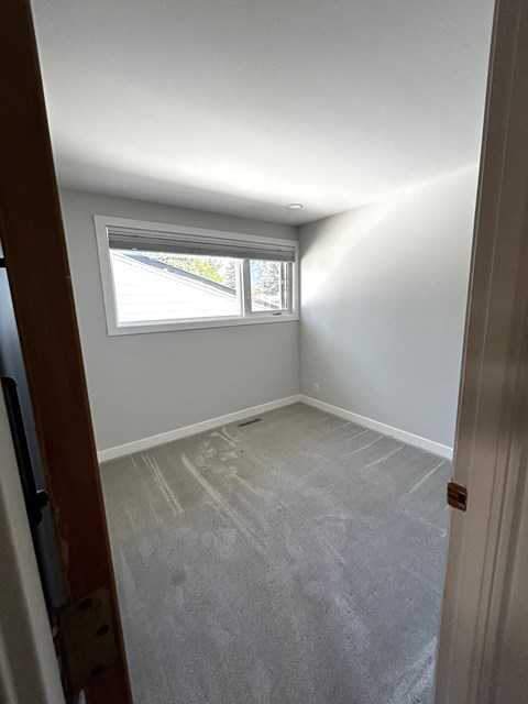 an empty room with a window in it