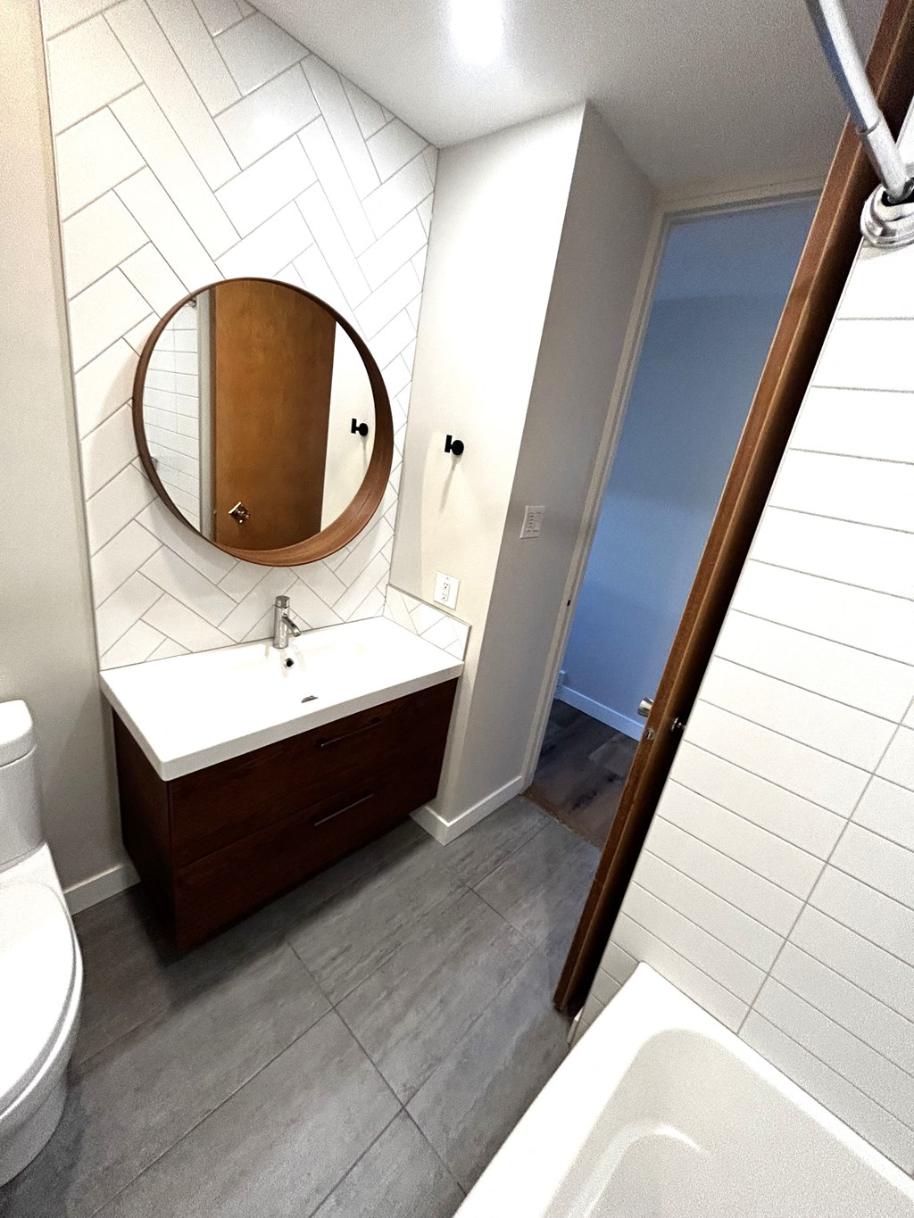 a small bathroom with a sink and a mirror