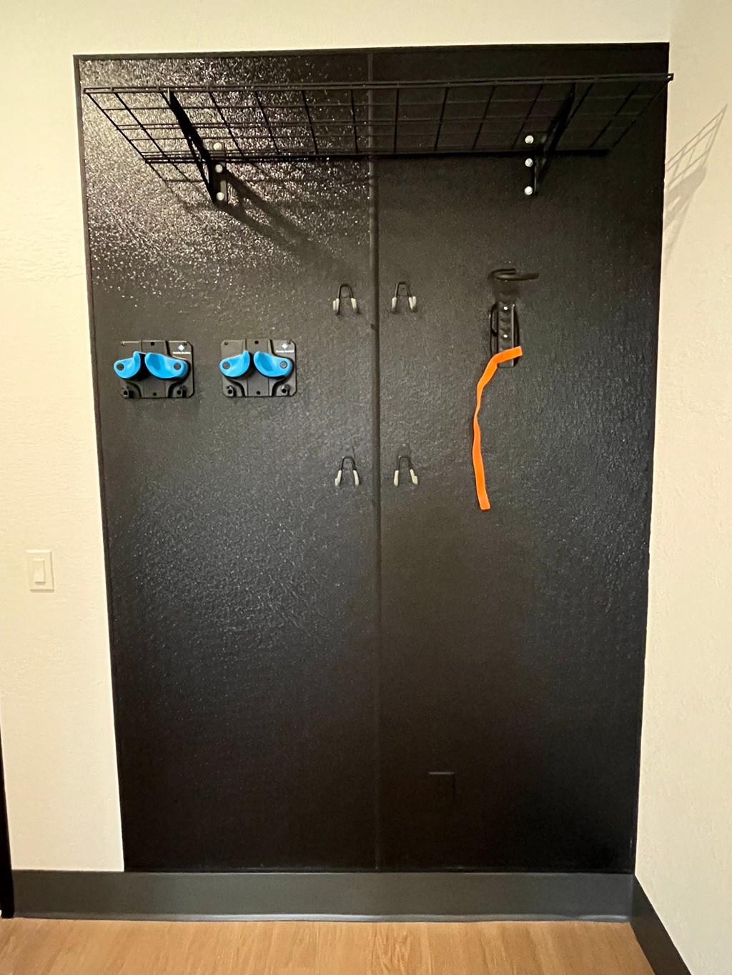 a closet with a pair of shoes on the door
