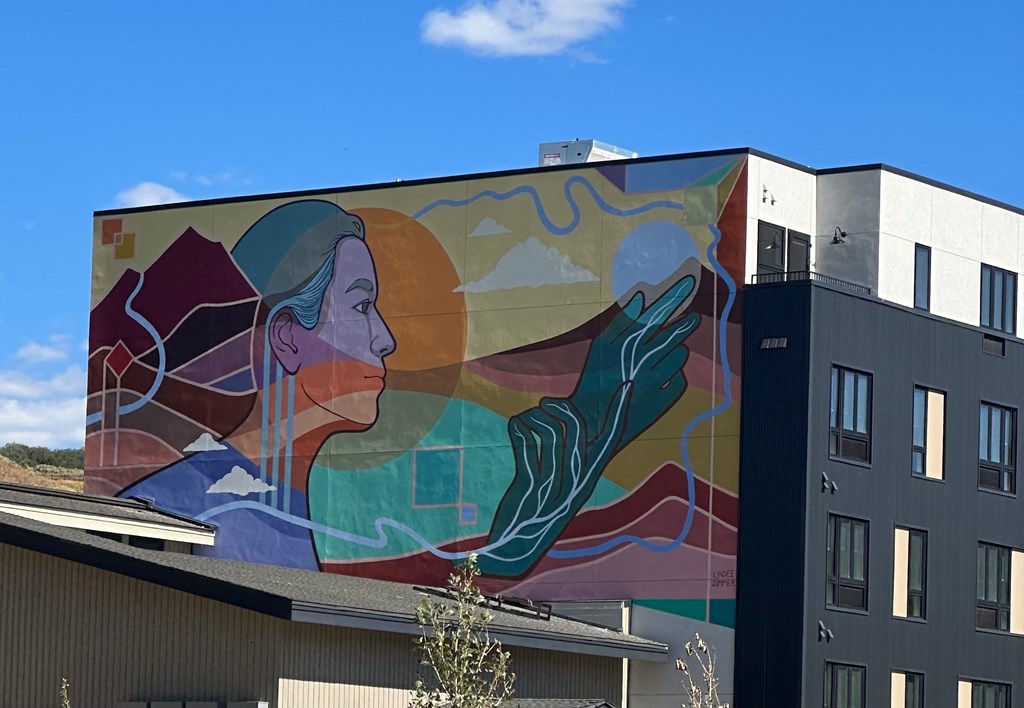 a mural of a woman on the side of a building