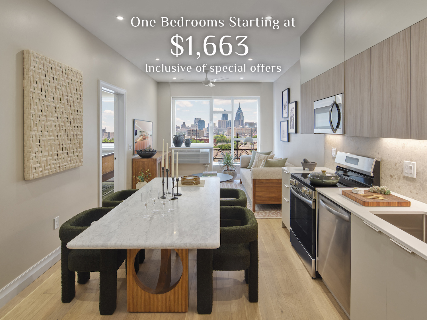 A kitchen with a marble table and a view of the city.