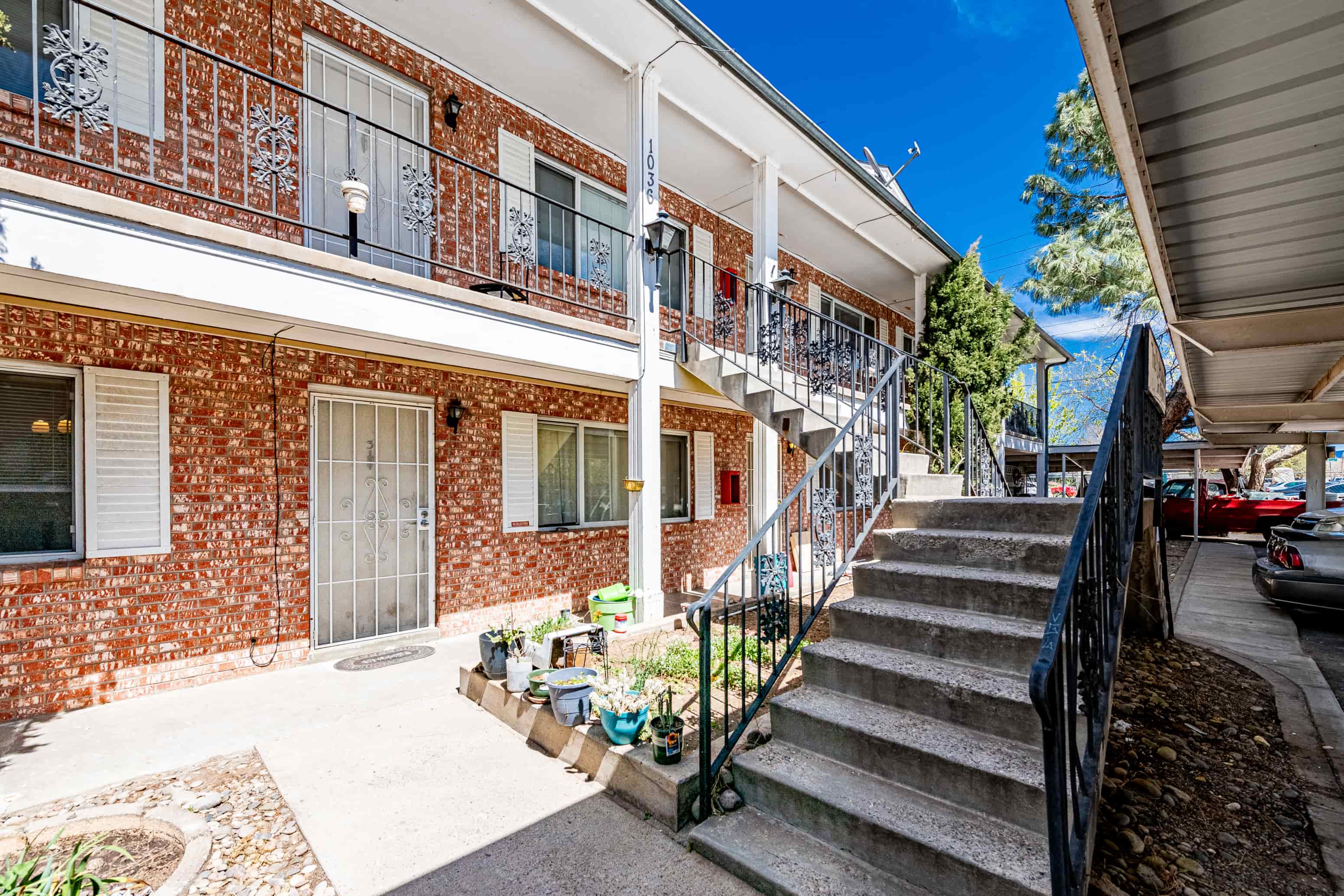 a brick building with stairs in front of it