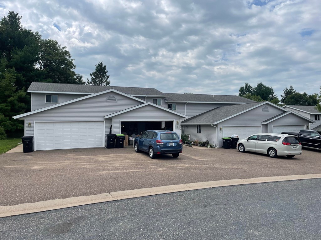 A house with a grey roof and a grey garage door.