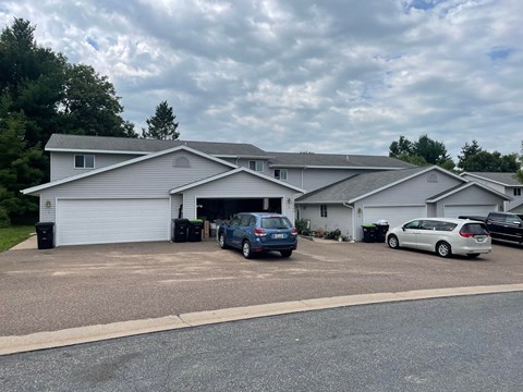A house with a grey roof and a grey garage door.