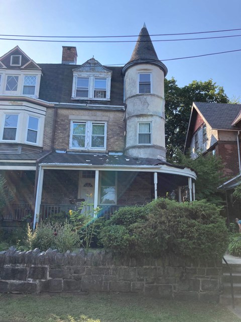 a large house with a tower on top of it