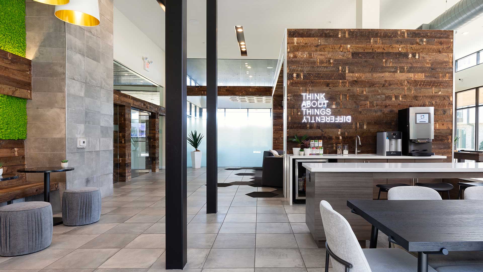 A modern lounge with wooden walls and a green wall.