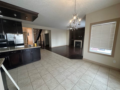 a view of the kitchen and living room from the dining room