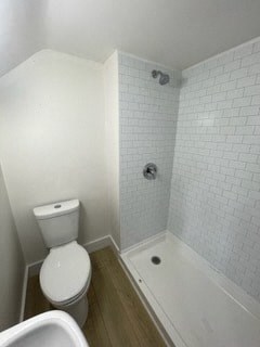 a small bathroom with a toilet and a shower